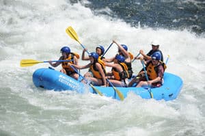 rafting through big rapids on a california river rafting trip