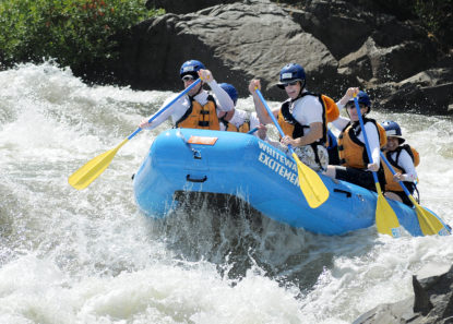 rafters paddling through rapid on south fork american river