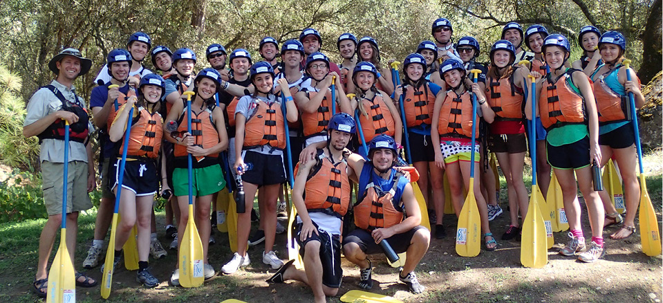church youth group wearing life jackets with paddles