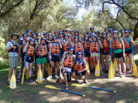 church group holding paddles for rafting on the banks of the south fork of the american river