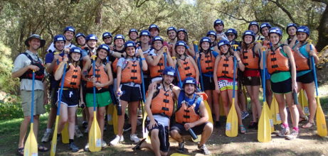 church group holding paddles for rafting on the banks of the south fork of the american river