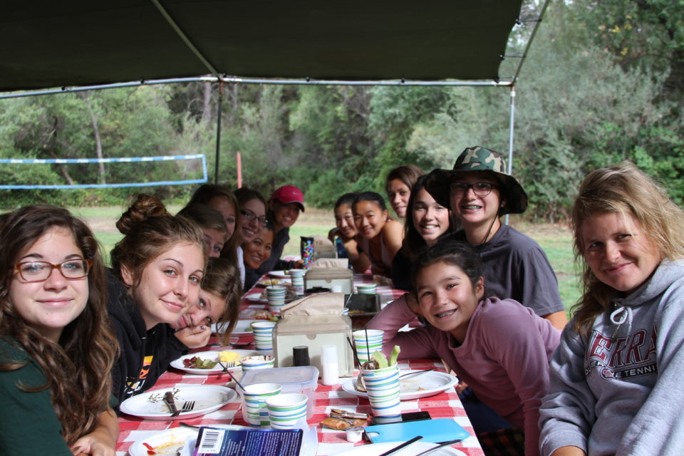 youth group eating nreakfast on a rafting trip