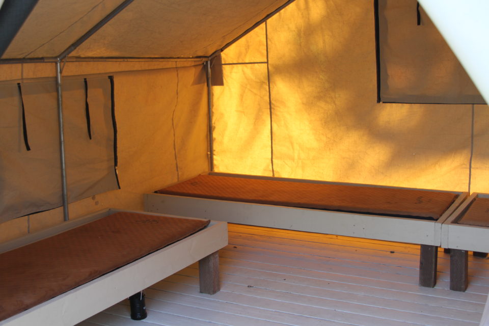 inside of Deluxe Cabin Tent with Queen and 3 Singles