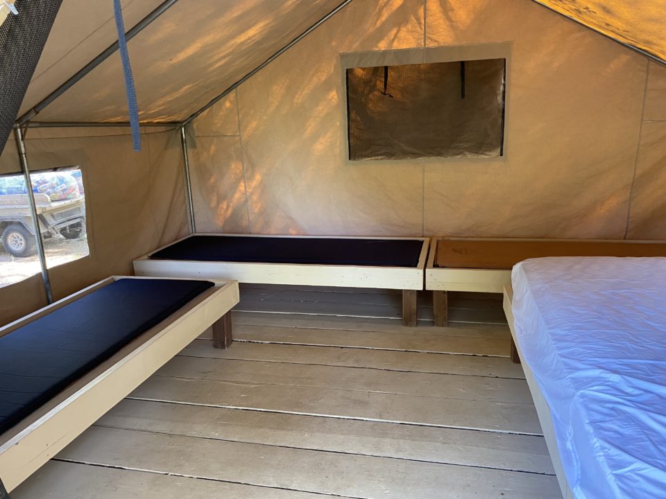 interior of a tent cabin with beds
