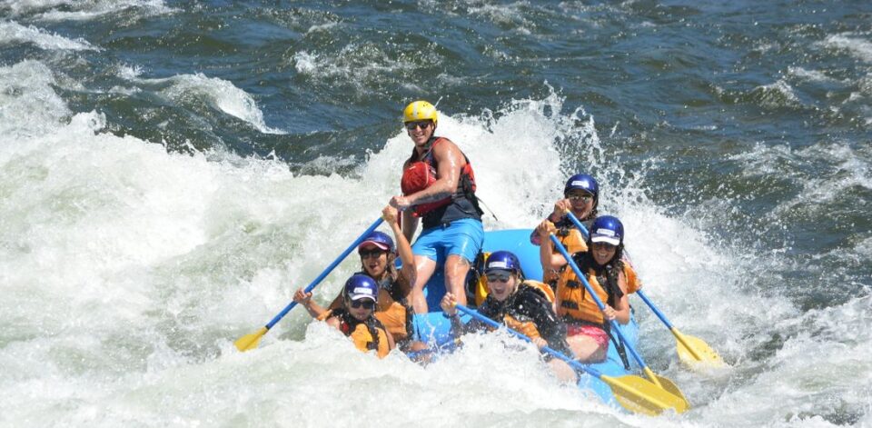 A boat rafting through a rapid