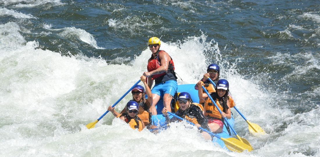 A boat rafting through a rapid